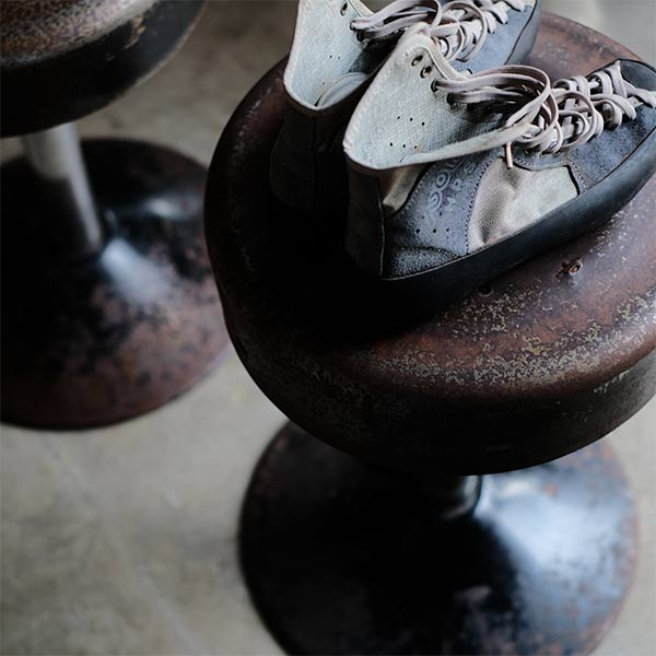A swivel stool with rusty iron legs
