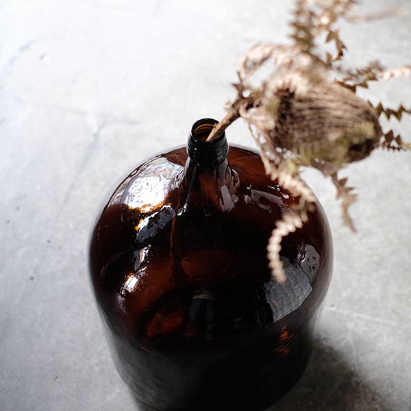 Amber demijohn bottle