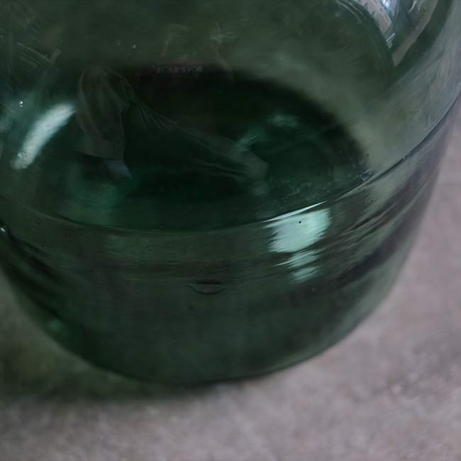 Aqua green demijohn bottle