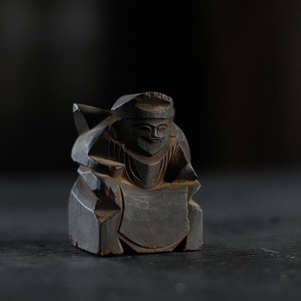 Wooden carving of Ebisu