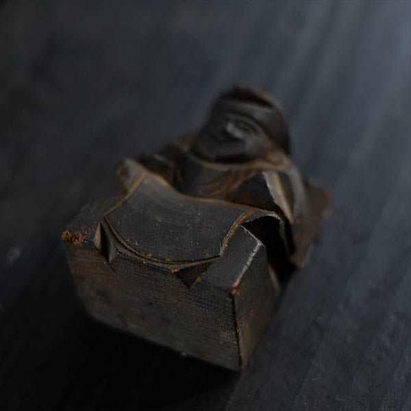 Wooden carving of Ebisu