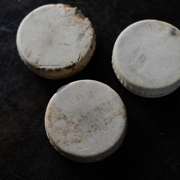 Leather-wrapped paperweight