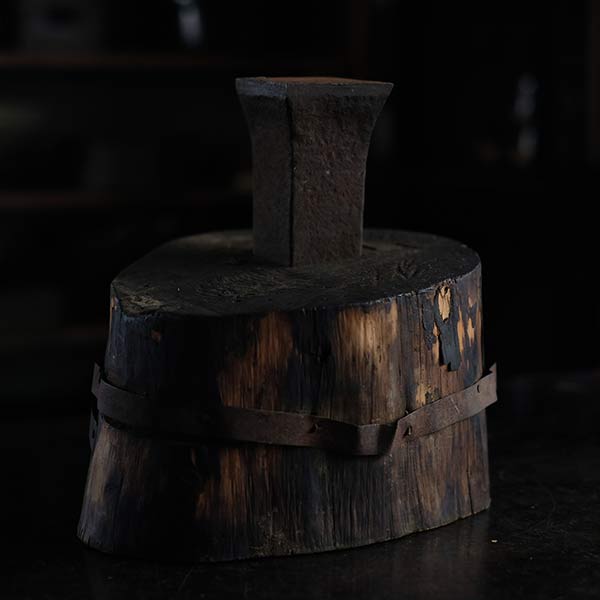 Anvil and wooden stand