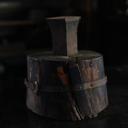 Anvil and wooden stand