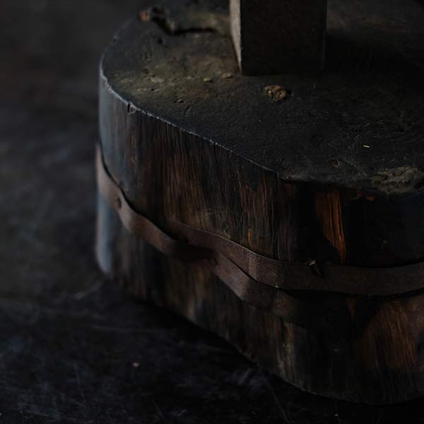 Anvil and wooden stand