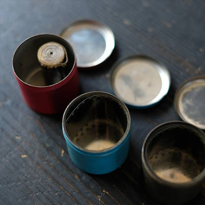 Tin case containing film