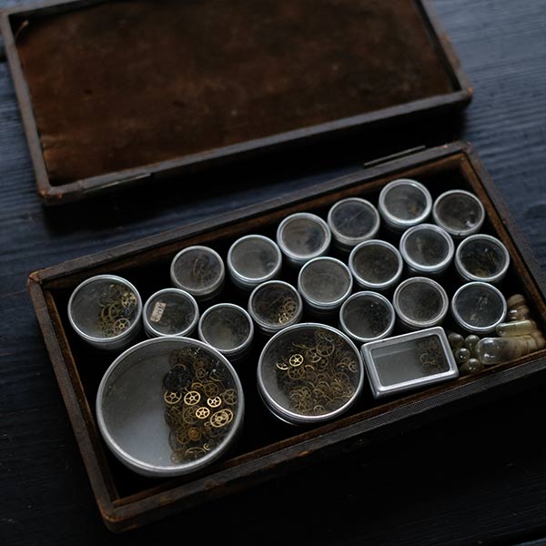 Set of mechanical watch parts cans and bottles