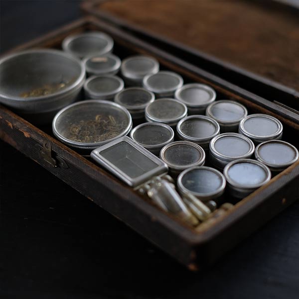 Set of mechanical watch parts cans and bottles