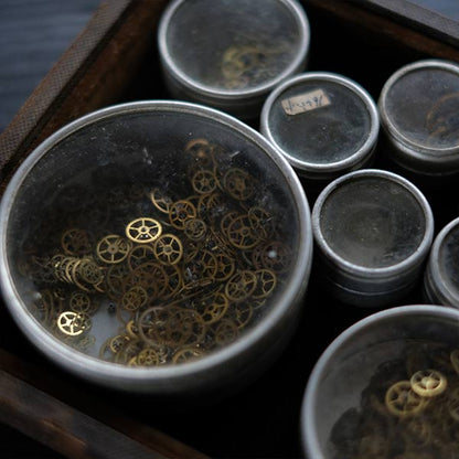 Set of mechanical watch parts cans and bottles