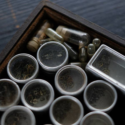 Set of mechanical watch parts cans and bottles