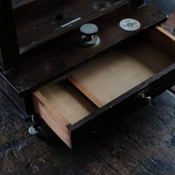 A small showcase made from a scale case (dark brown)