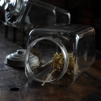Three carefully used candy jars