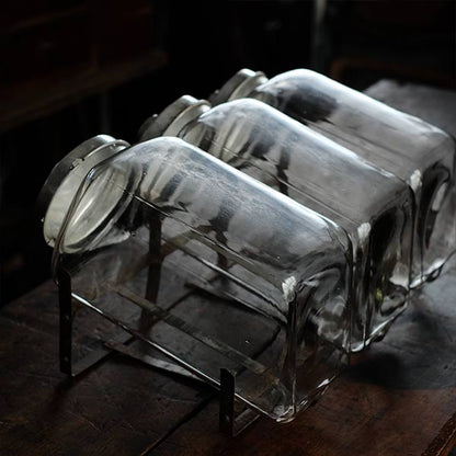 Three carefully used candy jars