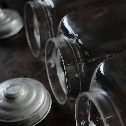 Three carefully used candy jars
