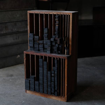 A set of black sticks used in a factory
