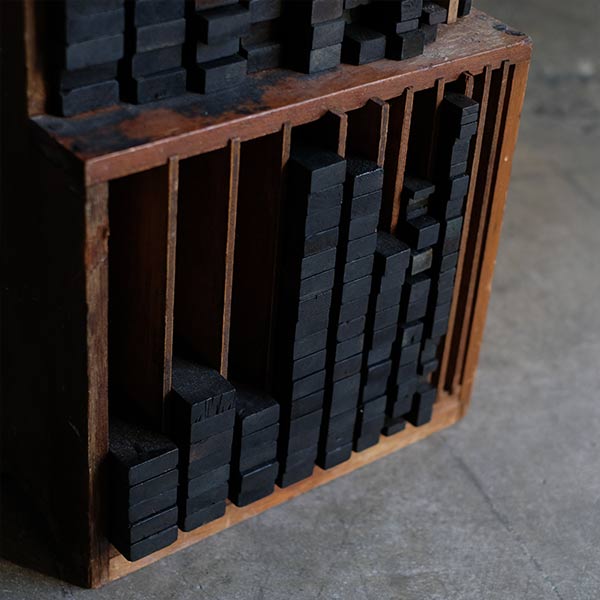 A set of black sticks used in a factory