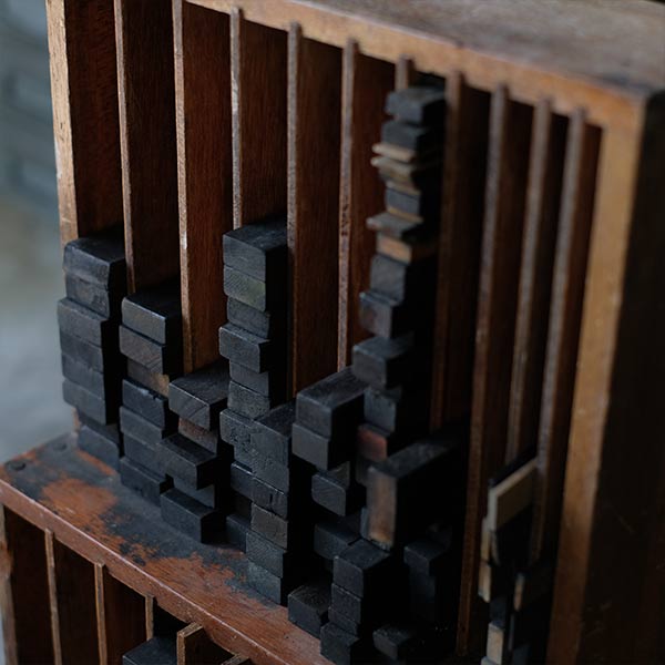 A set of black sticks used in a factory