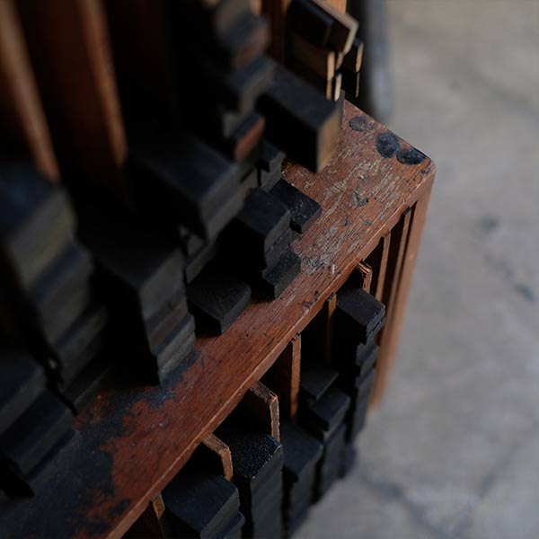 A set of black sticks used in a factory