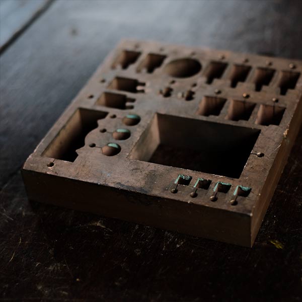 A stamped copper block