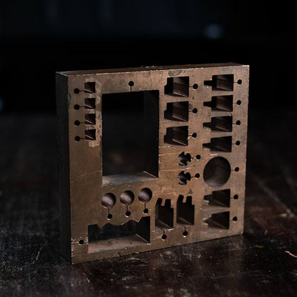 A stamped copper block
