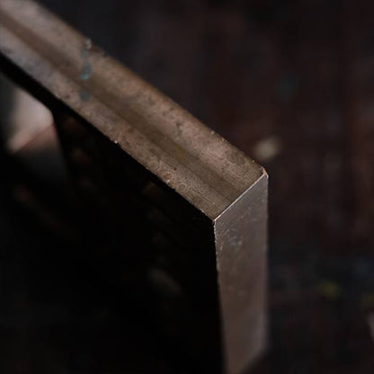 A stamped copper block