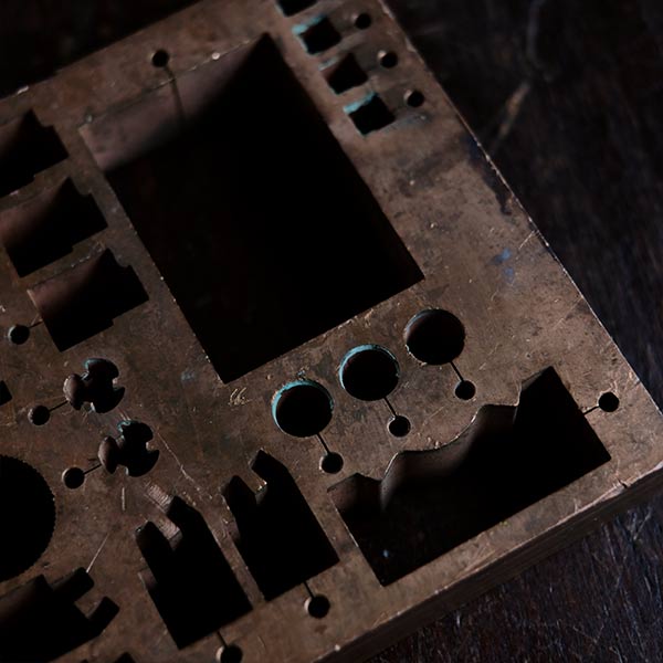 A stamped copper block