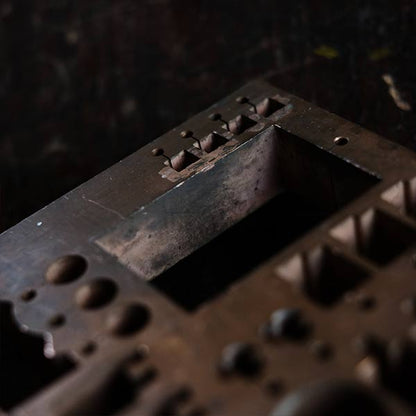 A stamped copper block
