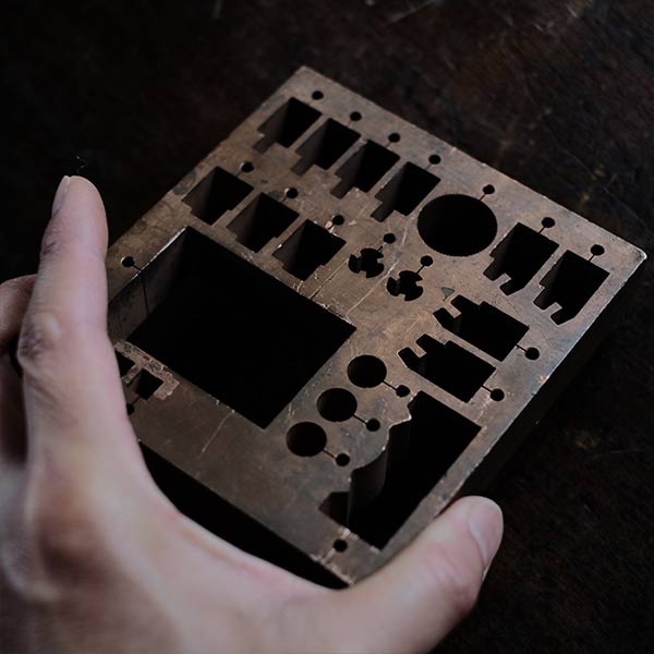 A stamped copper block
