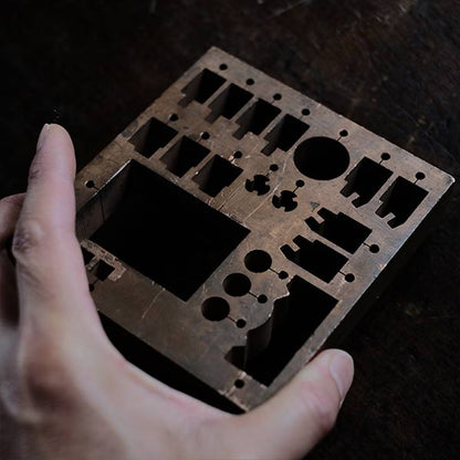 A stamped copper block