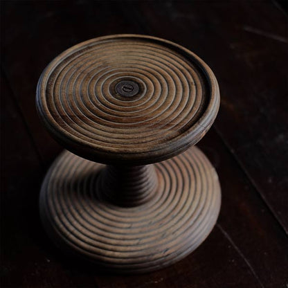 A distorted Showa-era electric fan stand