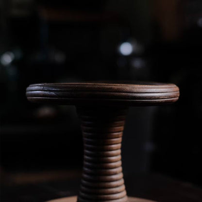 A distorted Showa-era electric fan stand