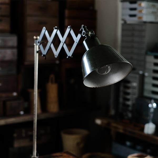Olive-colored scissor lamp