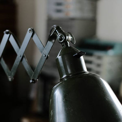 Olive-colored scissor lamp