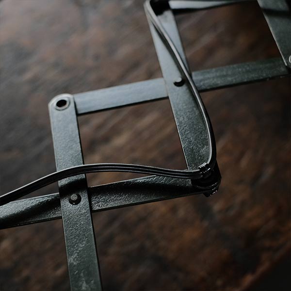 Olive-colored scissor lamp
