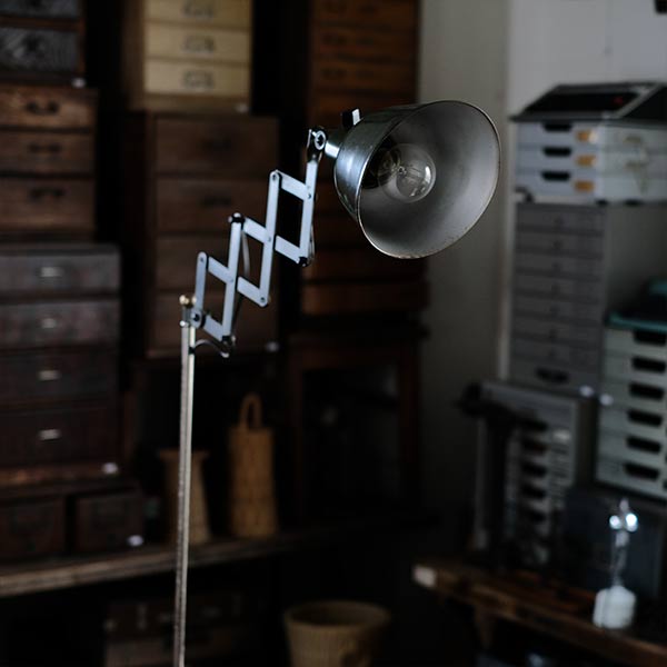Olive-colored scissor lamp
