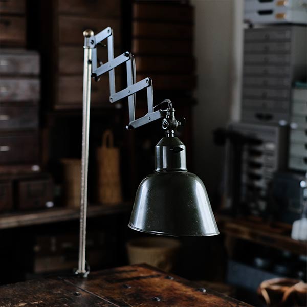 Olive-colored scissor lamp