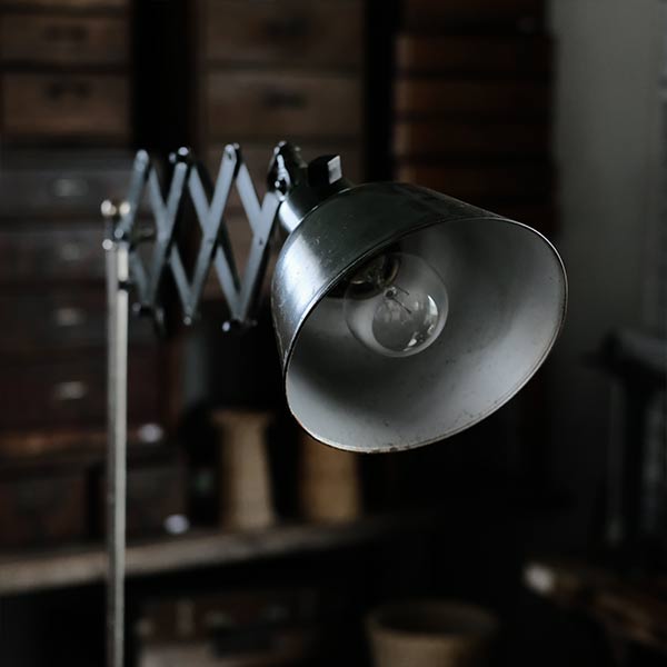 Olive-colored scissor lamp