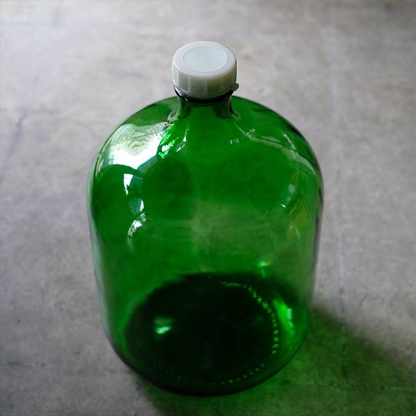 Green demijohn bottle