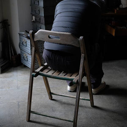 Folding chair with peeling paint
