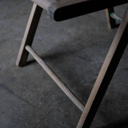 Folding chair with peeling paint