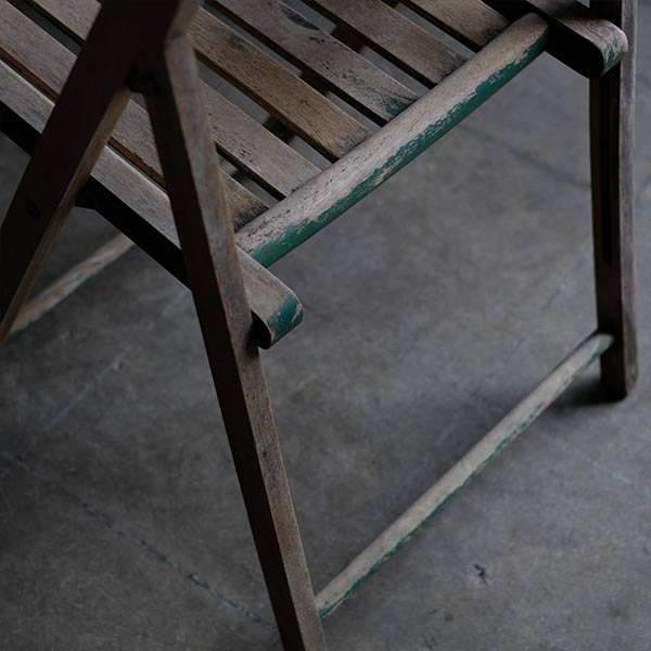 Folding chair with peeling paint
