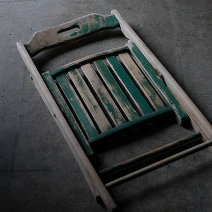 Folding chair with peeling paint