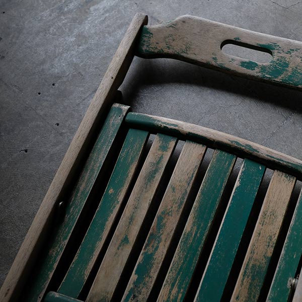 Folding chair with peeling paint
