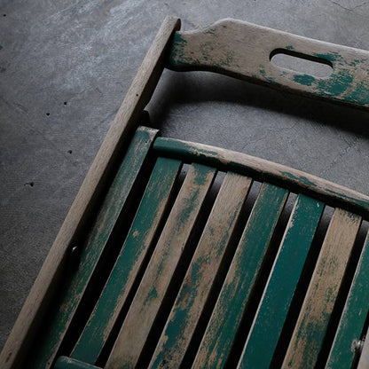 Folding chair with peeling paint