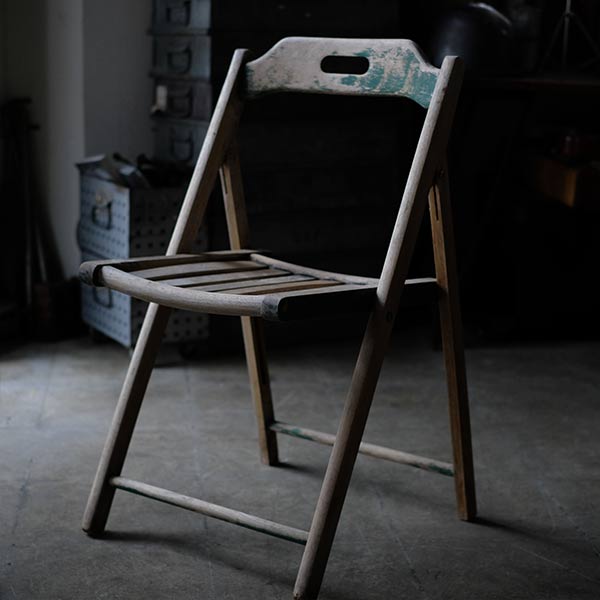 Folding chair with peeling paint
