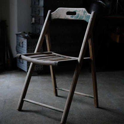 Folding chair with peeling paint