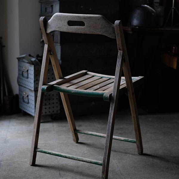 Folding chair with peeling paint
