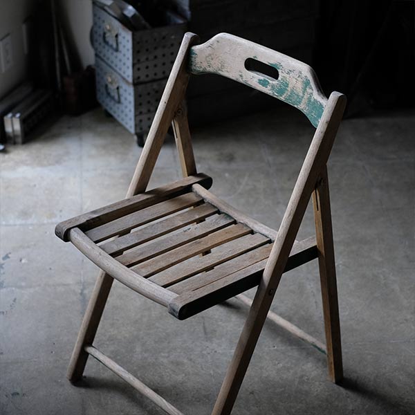 Folding chair with peeling paint