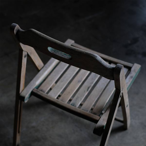 Folding chair with peeling paint
