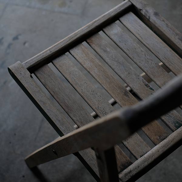 Folding chair with peeling paint